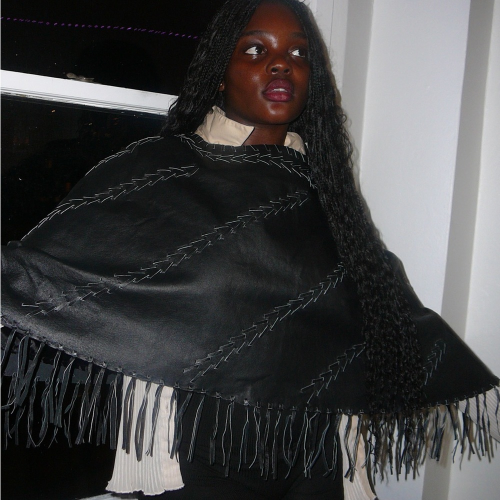 Genuine leather vintage poncho w/ beautiful fringes at the end.